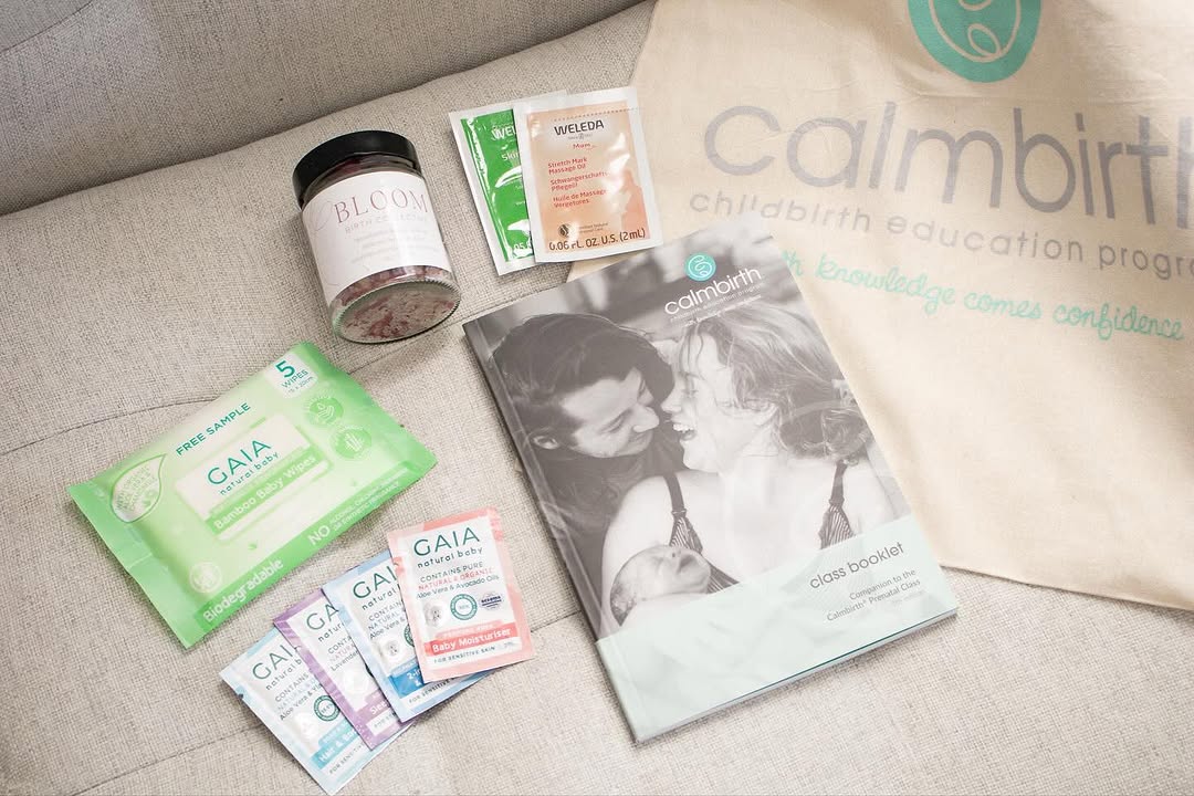 Calmbirth goodie bag gifts from Bloom Birth Collective including baby samples, bath salts, calmbirth booklet and calmbirth tote bag